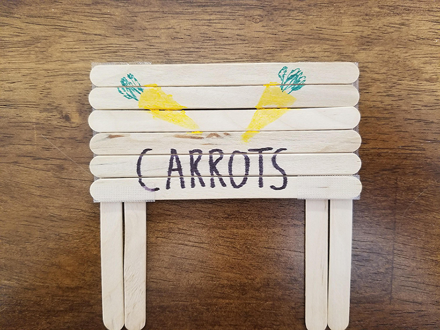 Paper prototype sign of carrot using paper and popsicle sticks