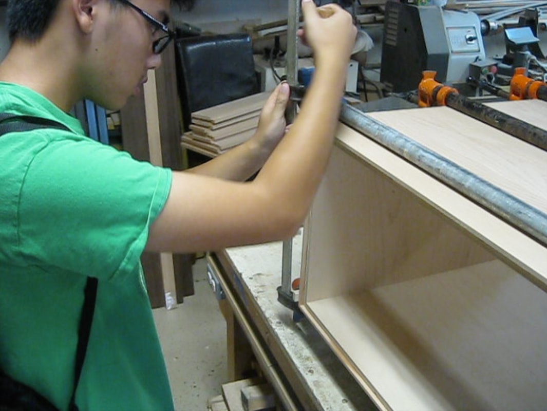 Me attaching clamps to a drawer