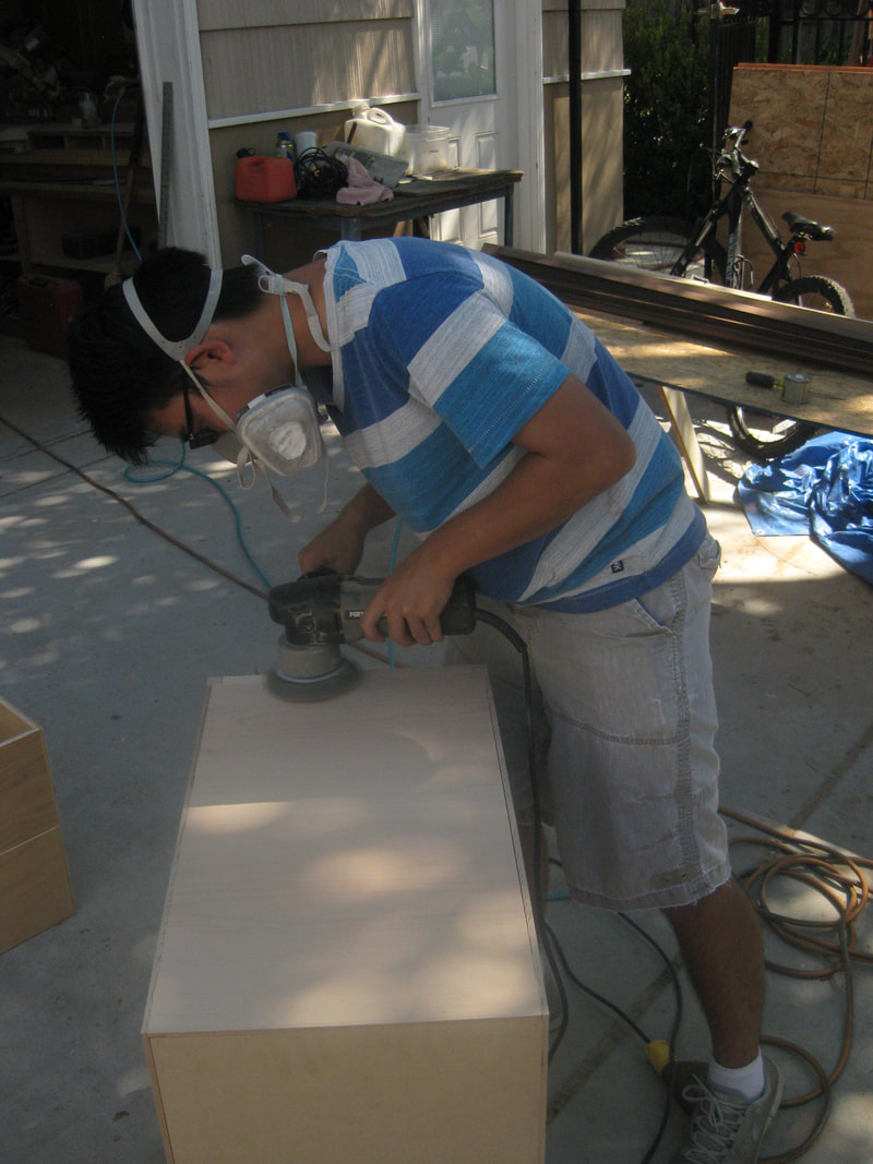 Me sanding the top a drawer