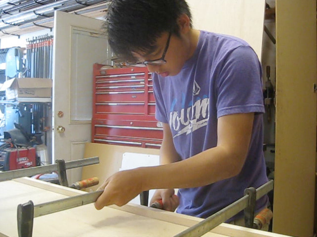 Me clamping face frames to the shelf board