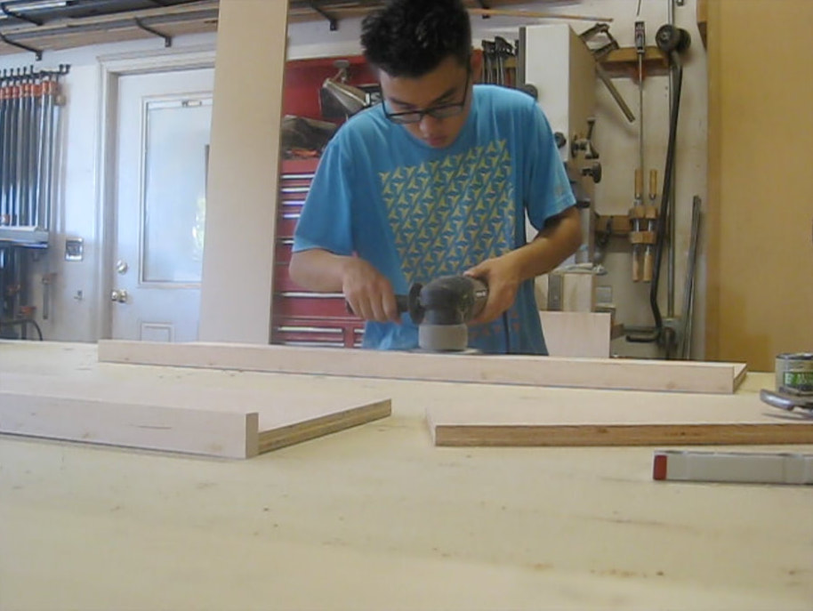 Me sanding shelf board