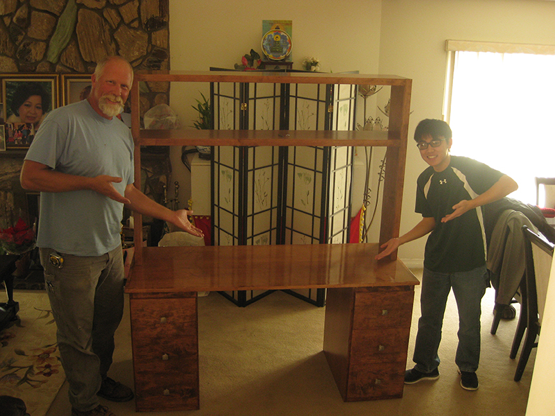Mentor and I showcasing the finished wooden desk